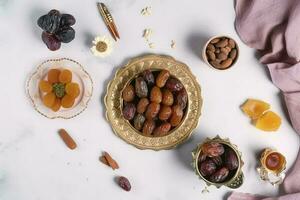 Eid al-Fitr holiday concept with sweet dried dates, fruits and decorations on bright background. Top view from above, generate ai photo