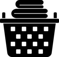 Black And White Basket With Clothes Icon. vector