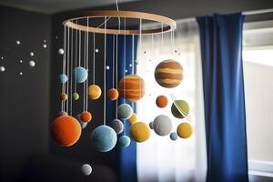 Solar system made of felt, hanging mobile above the baby crib, child toys, science for infants. Baby crib mobile with stars, planets and moon. First baby eco-friendly toys. image. photo