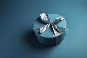 Gift box with satin ribbon and bow on blue background. Holiday gift with copy space. Birthday or Christmas present, flat lay, top view. Christmas giftbox concept. . photo