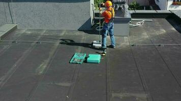 Aerial View of Technician Assembling Metal Rod Lightning Protection Element on the Roof. video