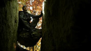 Caucasian Caver in His 30s with Flashlight Relaxing on the Rock Formation. video