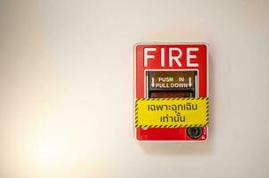 Fire alarm on the wall in subway in Bangkok,  At the Bangkok subway fire warning equipment for emergency. photo