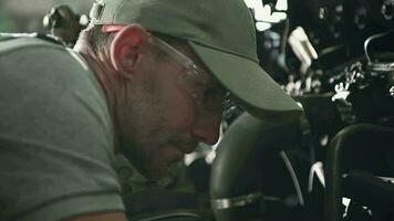 Close up Of Auto Technician Fixing Engine. video