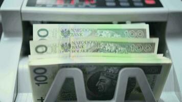 Close Up Of Currency Counting Machine Calculating Two Batches Of Foreign 100 Banknotes. video