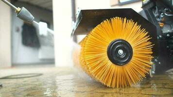 Slow Motion Footage of Men Cleaning His Power Brush Using Pressure Washer. video