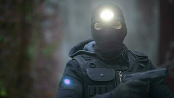 Police Top Secret Operation. Counter Terrorist in His 30s in Black Mask and Head Flashlight. video