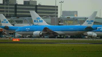 AMSTERDAM, THE NETHERLANDS JULY 27, 2017 - KLM Asia Boeing 777 PH BQH taxiing after landing. Shiphol Airport, Amsterdam, Holland video