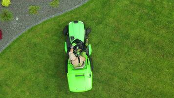 Man On Lawn Care Riding Mower. video