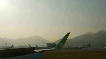 HONG KONG NOVEMBER 7, 2019 - Hong Kong Airport from the window of landing aircraft video