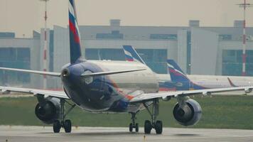 MOSCOW, RUSSIAN FEDERATION JULY 28, 2021 - Passenger Airbus 320 of Aeroflot taxiing to the runway at Sheremetyevo Airport SVO. Tourism and travel concept video