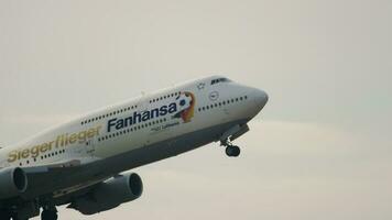 FRANKFURT AM MAIN, GERMANY JULY 17, 2017 - Passenger Boeing 747 Lufthansa takes off at Frankfurt Airport FRA. Fanhansa from Lufthansa for the 2014 FIFA World Cup. Close up of jumbo jet in the sky video