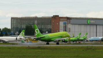 NOVOSIBIRSK, RUSSIAN FEDERATION JULY 15, 2022 - Airbus A320 of S7 Airlines landing, touching and braking, side view. Tourism and travel concept video