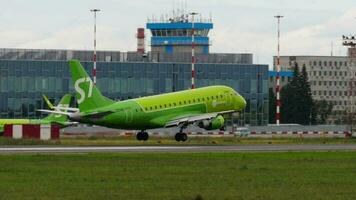 NOVOSIBIRSK, RUSSIAN FEDERATION JULY 15, 2022 - Embraer E170SU, RA 02745 of S7 Airlines arriving, side view. Airplane landing and touching. Tourism and travel concept video