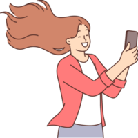 Happy woman takes selfie on mobile phone camera and smiles standing with hair blowing in wind png