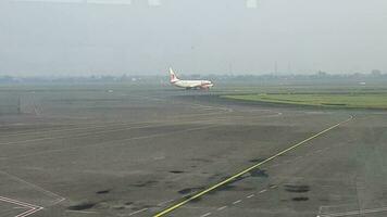 Tangerang, Indonesia in May 2023. Several aircraft, namely Air Asia, Lion Air and several other aircraft on the apron and runway of Terminal 2 of Soekarno Hatta Airport. video