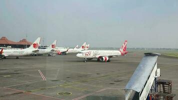 Tangerang, Indonesia in May 2023. Several aircraft, namely Air Asia, Lion Air and several other aircraft on the apron and runway of Terminal 2 of Soekarno Hatta Airport. video