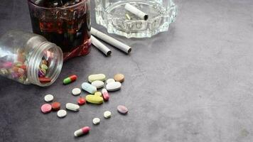 Alcohol, pills and cigarette on table video