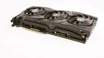 big black contemporary gaming graphics card on white background - loopable spinning closeup view video