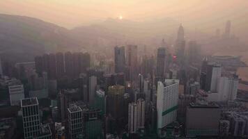 Aerial View drone 4k footage Of Modern Skyscrapers In Hong Kong City. buildings in Hong Kong city on sunrise. video