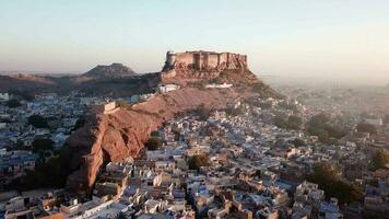 Aerial view 4k video by drone of Blue City village In Jodhpur, Rajasthan, India on sunrise.