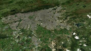 satélite bogota mapa antecedentes bucle. hilado alrededor Colombia ciudad aire imágenes. sin costura panorama giratorio terminado céntrico fondo. video