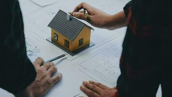 Engineer Teamwork Meeting, Drawing working on blueprint meeting for project working with partner on model building and engineering tools in working site, Construction and structure concept. video