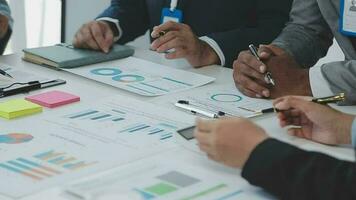Financial analysts analyze business financial reports on a digital tablet planning investment project during a discussion at a meeting of corporate showing the results of their successful teamwork. video