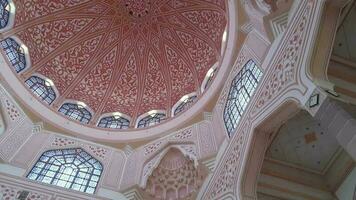 Putra Jaya, Malaysia in May 2023. Putra Mosque or in Malay is Masjid Putre is a mosque that was built in 1997 using rose red granite and consists of three functional areas prayer room, mosque yard, video