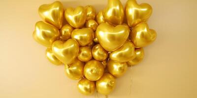 Arrangement of golden heart shape balloons photo