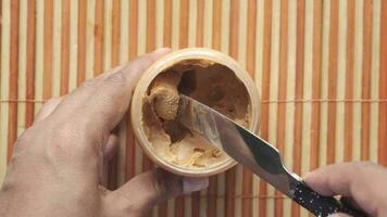 Top view of peanut butter in a container video