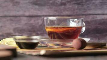 Top view of ginger tea on wooden background video