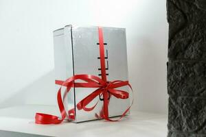 Gift box with ribbon end bow isolated on the white background, clipping path included. photo