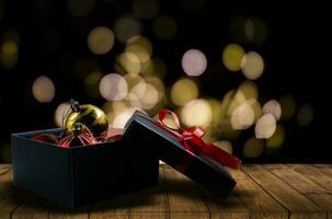 Christmas presents laid on a wooden table background photo