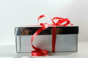 Gift box with ribbon end bow isolated on the white background, clipping path included. photo