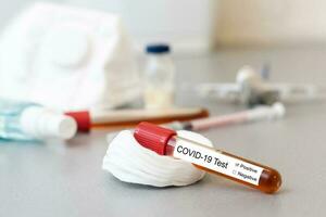 test tubes with vaccines on the table photo