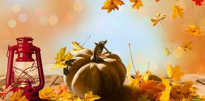 Autumn scene with pumpkins, Halloween or Thanksgiving background, burning lantern and sparkling part lights behind with copy space photo