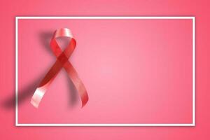 pink ribbon on pink background with copy space photo