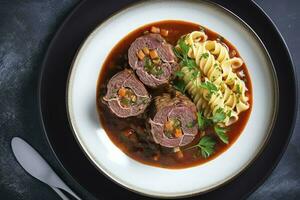 Traditional slow cooked German Wagyu beef roulades with gnocchetti sardi noodles in a spicy gravy as a top view on a Nordic design plate with copy space on the right, generate ai photo