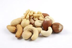 Cashew nuts, almond, hazelnut and blanched peanuts isolated on white background, generate ai photo