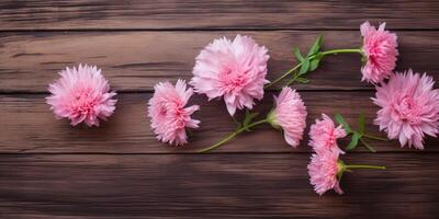 rosado flores en un de madera mesa ai generado foto