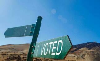 Crossroad signpost saying this way, that way, voted photo