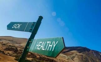 Crossroad signpost saying this way, that way, healthy photo