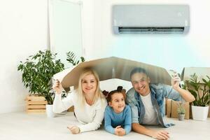 air conditioning in living room with happy family moving to new apartment photo