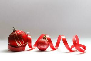 christmas decoration ball with ribbon bow isolated on white background photo