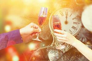 Two glasses of champagne with lights in the background. christmas background photo