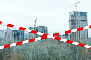 red and white safety tape at the construction site photo