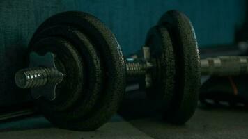 Dumbbells on a wooden floor. Close-up. photo