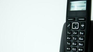 Close up of a house phone on white background with copy space for text photo