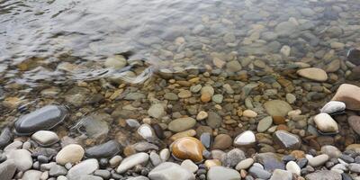 water surface with rock and pebbels on it photo